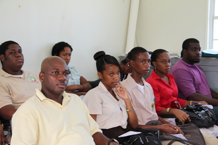 (L-R) Hydroponics Farmer on Nevis Mr. Marcel Hanley sits with students and Teacher from the Gingerland Secondary School and other participants at the Hydroponics Nutrients Workshop in Prospect