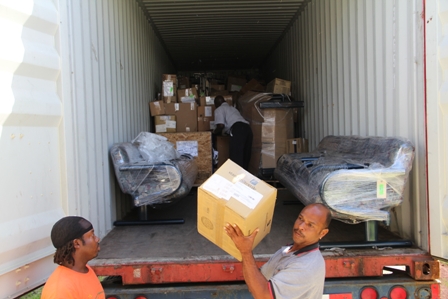 Alexandra Hospital Maintainance staff unloading the container filled with medical supplies, equipment and furniture from Global Links