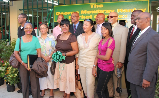 Premier of Nevis the Honourable Joseph Parry and Agriculture Minister the Honourable E. Robelto Hector share proud moment with members of the Hanley family