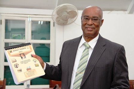 Premier of Nevis, Hon. Joseph Parry holding 2012 Budget Address Booklet