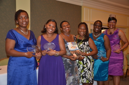 Reading Recovery Specialist Mrs. Palsy Wilkin (third from left) with teachers honoured for their work in Reading Recovery (L-R) Mrs. Omelle Browne, Mrs. Julie Pemberton, Ms. Leona Freeman, Mrs. Terres Dore and Mrs. Judy Parris-Rawlins