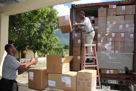 The 40ft container load of medical supplies and equipment being offloaded by Maintenance Staff of the Alexandra Hospital 