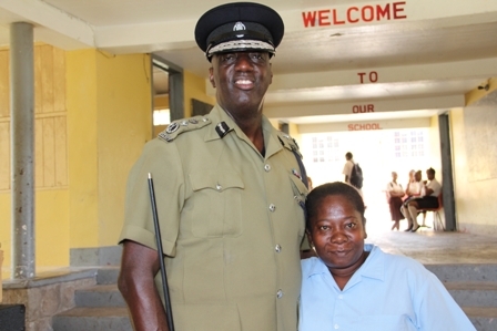 Commissioner of Police in the Royal St. Christopher and Nevis Police Force Celvin G. Walwyn (l) interacts with staff at the Gingerland Secondary School