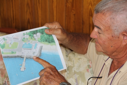 Former Director of Fisheries on Nevis Captain Arthur Anslyn looks approvingly at an artist’s impression of the new Charlestown Community Fisheries Complex at Gallows Bay