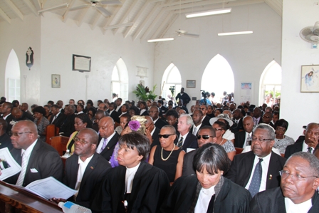 Attendees of the funeral inside the church  
