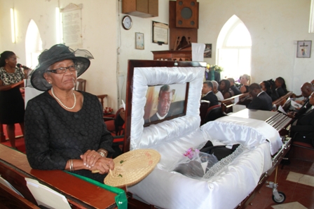 Widow of Dr. Daniel, Mrs. Sheila Daniel beside Dr. Simeon Daniels Coffin