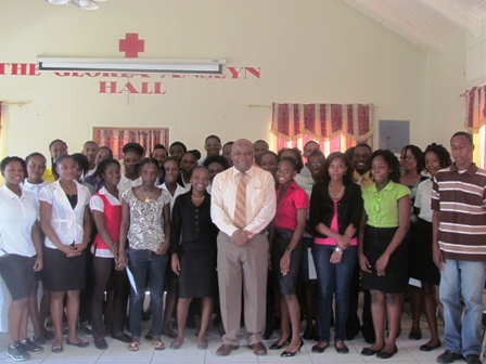Successful interns of the of 2012 Summer Job Attachment Programme at the closing ceremony with then Minister of Social Development and Youth Hon. Hensley Daniel at the annual programme’s closing ceremony at the Red Cross conference Room in Charlestown