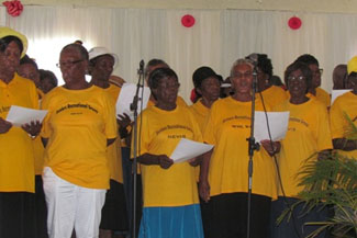Seniors singing at the Nevis Senior Citizen Luncheon