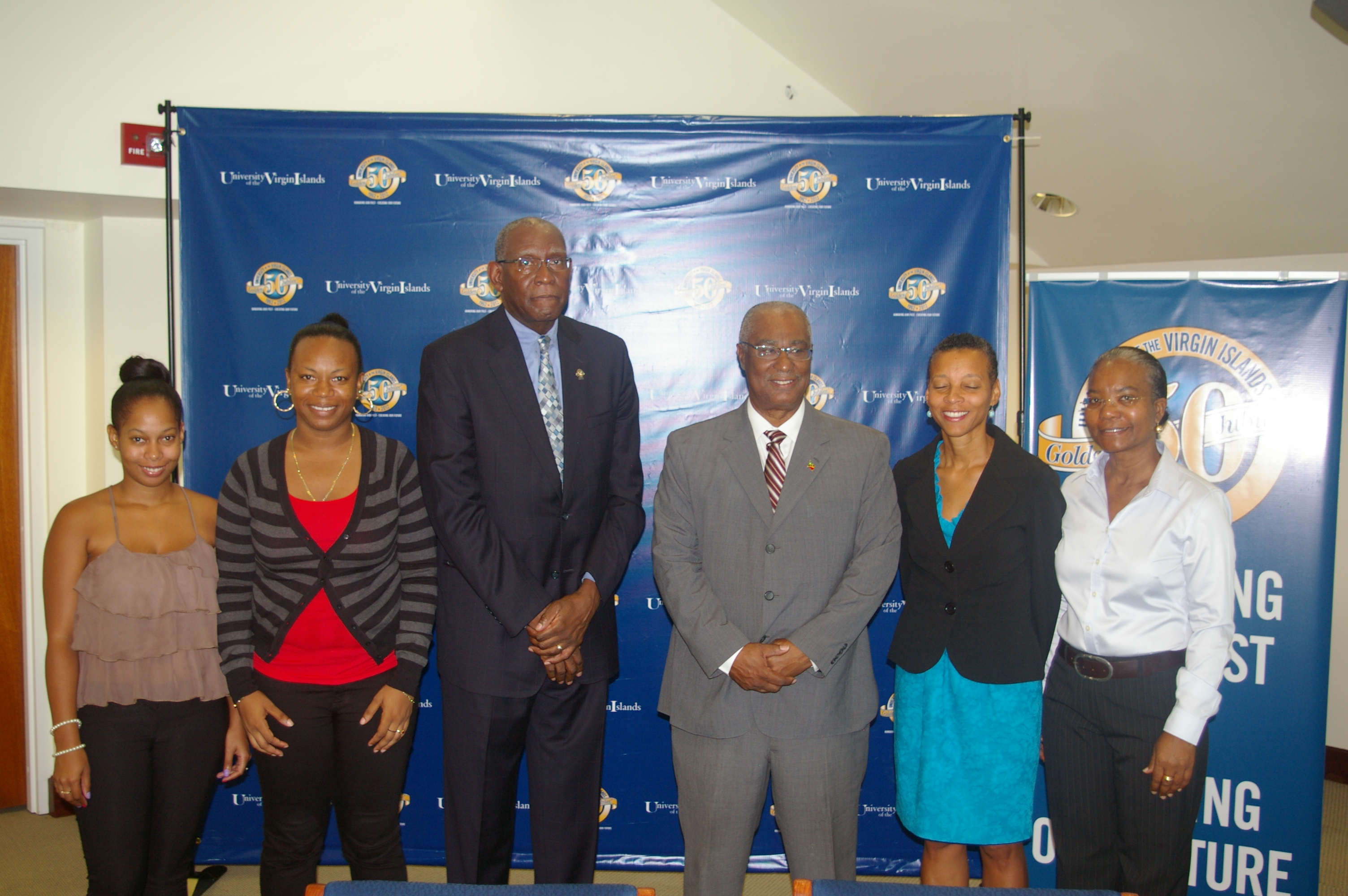(L-R) UVI students-Ms.Abigail Parry and Ms Aujeunelle Brown, UVI President- Mr. David Hall, Premier of Nevis, Hon. Joseph Parry and UVI staff members.  