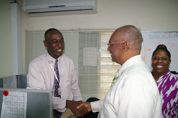 Premier Parry shaking hands with Mr. Keeton Jones, Brown Hill Communications staff