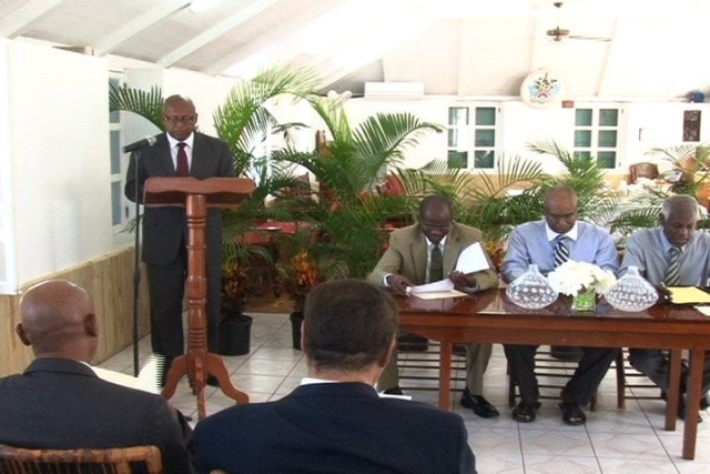 Permanent Secretary in the Ministry of Finance on Nevis Mr. Laurie Lawrence at the podium with (l-r) Attorney General of St. Kitts and Nevis Hon. Patrice Nisbett, Premier of Nevis Hon. Joseph Parry and Legal Advisor in the Nevis Island Administration Mr. Herman Liburd at the head table during the launching ceremony of the New Revised Laws of St. Christopher and Nevis (Nevis Ordinance) at Hamilton House in Charlestown