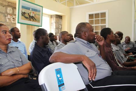  Police Officers listen attentively during the Royal St. Christopher and Nevis Police Force, Nevis Division’s New Year’s Blessings ceremony at the Headquarters in Charlestown