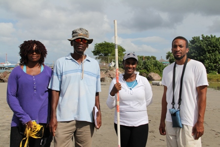 (l-r) Physical Planning Officer in the Department of Planning Thema Ward, Environmental Specialist Lemuel Pemberton, Environmental Officer Claudia Walwyn and Geographic Information Systems Officer Joel Williams participate in the Beach Profiling Project at Gallows Bay on October 30, 2013