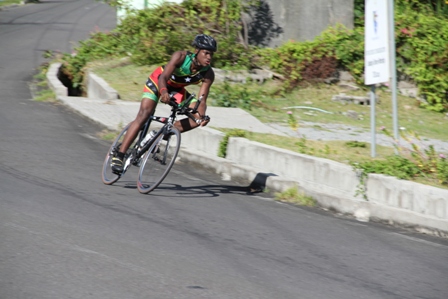Nevisian Triathlete Romel Gaskin zooming down Zion Hill while cycling round the island of Nevis during the 60k bike segment of the MaccaX Nevis International Triathlon on November 16, 2013