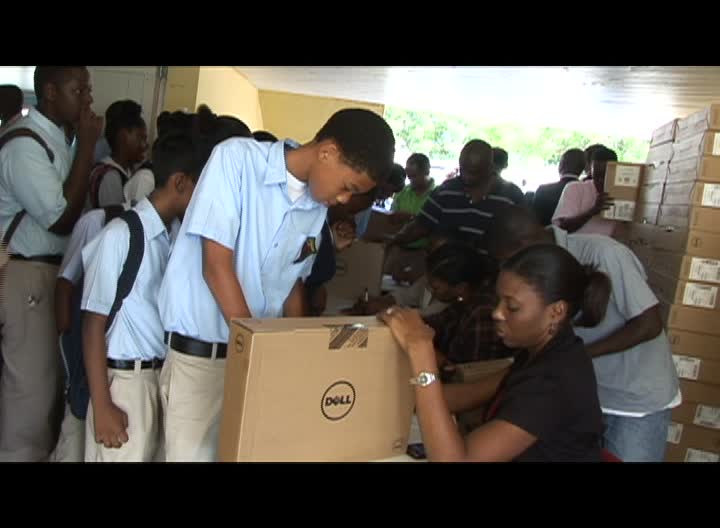 First and Second Form students at the Charlestown Secondary School lining up for the computers from the Federal Government’s One to One Laptop Programme on December 3, 2013