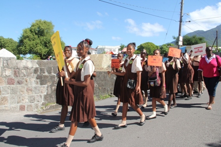Students of the Gingerland Secondary School march in observance of World AIDS Day 2013