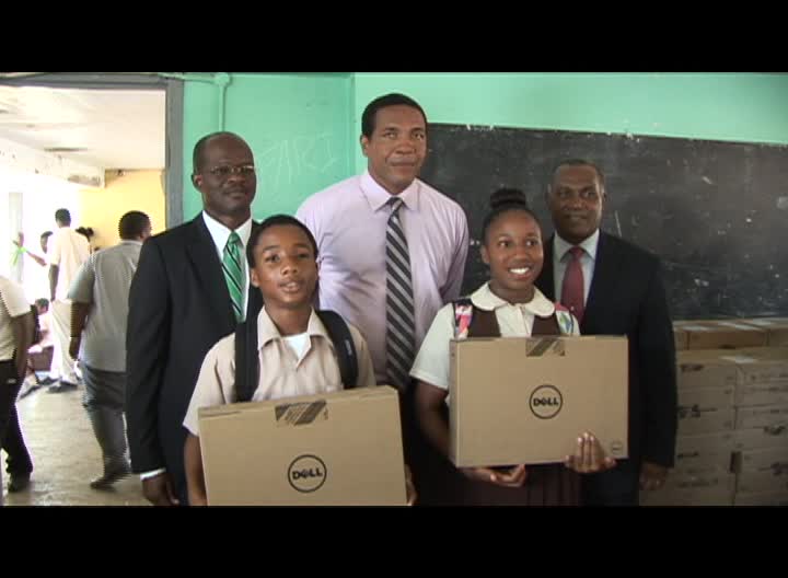 First and Second Form students at the Gingerland Secondary School with computers from the Federal Government’s One to One Laptop Programme on November with (back row l-r) Federal Ministers Hon. Patrice Nisbett and Hon. Glen Phillip and Premier of Nevis and Minister of Education Hon. Vance Amory
