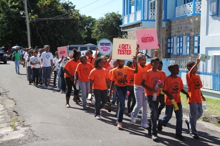 Students from schools on Nevis march in observance of World AIDS Day