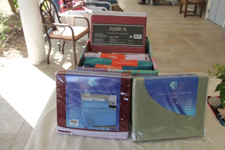 Sheet sets donated to the Flamboyant Nursing Home on February 12, 2014 from the Bank of Nevis Social Club