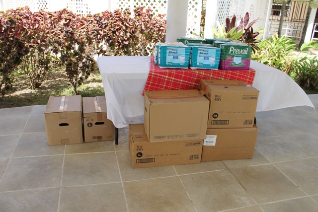 Some of the Nevis Association of South Florida’s donation of 107 boxes of adult protective underwear to the Flamboyant Nursing Home on May 19, 2014
