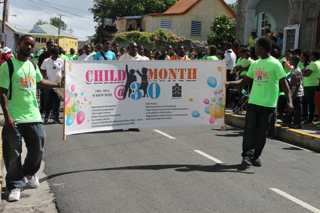 The banner for the 30th annual Child Month Parade on show in Nevis during the Child Month Parade in Charlestown on June 06, 2014
