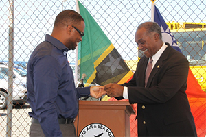 Premier of Nevis Hon. Vance Amory hands over the keys to a refuse disposal truck, for use by the Nevis Solid Waste Management Authority which was donated by Tainan County in southern Taiwan, to Deputy Premier of Nevis and Minister of Health Hon. Mark Brantley on July 21, 2014 moments after the keys were handed over by Republic of China (Taiwan)’s Resident Ambassador to St. Kitts and Nevis His Excellency Miguel Tsao