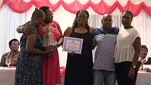 Children of the late Ms. Laura Blake of Brick Kiln Village accepting an award on behalf of their late mother from Junior Minister responsible for Social Development on Nevis Hon. Hazel Brandy-Williams, for her contribution to the development of Culture at the Gala and Awards ceremony hosted by the Department of Social Development, Seniors Division on October 23, 2014