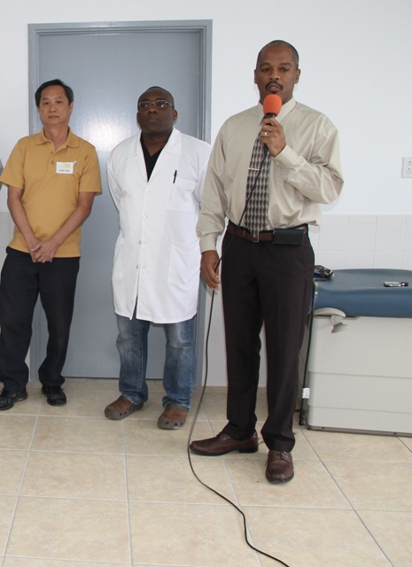 (l-r) Andar International - Miami Technician Mr. Don Chin, Medical Chief of Staff at the Alexandra Hospital Dr. John Essien and Hospital Administrator Gary Pemberton at the commissioning ceremony of two new machines at the Alexandra Hospital on November 26, 2014