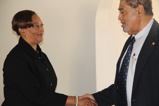 Deputy Governor General His Honour Eustace John congratulates Justice Lorraine Williams on her appointment as the new Resident Judge of the St. Christopher and Nevis High Court, Nevis Circuit at his Bath Plain Office on January 12, 2015