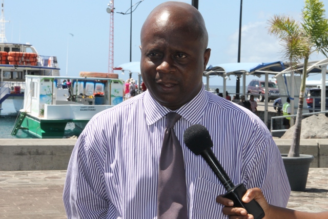  Permanent Secretary in the Premier’s Ministry Wakely Daniel seeing off the Nevis 6th Form College’s Literary and Debating Society Debaters on Wednesday 25th February, 2015 at the Charlestown Pier.