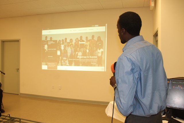 Youth Development Officer Stephan Joseph presents the Department of Youth and Sports website at its launch on February 09, 2015 at the Emergency Operations Centre at Long Point