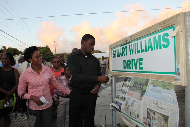 Stuart Williams’ son, Saeed Williams unveils the road sign bearing his father’s name Stuart Williams Drive on February 03, 2015