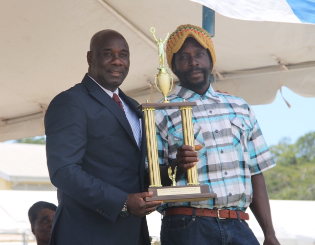 Top livestock farmer in Nevis for 2014 Livingston Hanley receives his Department of Agriculture award from Minister of Agriculture Hon. Alexis Jeffers at the 21st Annual open Day hosted by the Department of Agriculture