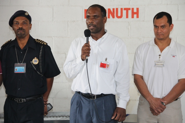(L-R)Deputy Comptroller of Customs Cynric Carey, Permanent Secretary in the Ministry of Finance in the Nevis Island Administration (NIA) Colin Dore and Co-Founder of Security Equipment Services and Representative for Autoclear, the manufacturer of the X-ray system Salvador Leanos at the X-ray inspection system Handing Over Ceremony on March 13,2015 at the Long Point Port