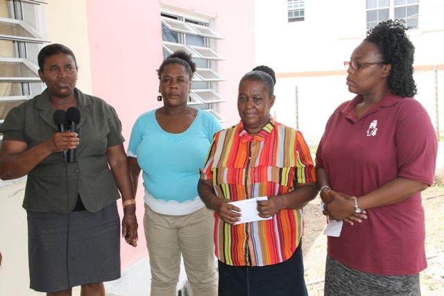 (L-R) Co-ordinator of the Department of Social Services Single Parents Group Grace Manners alongside members of the Single Parents Group - Lydia Lawrence, Gloria Pemberton and Rhonda Forbes at the home of cancer patient Raymond Maynard on June 23, 2015 making a donation to assist with his medical expenses 