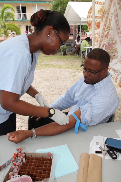 Deputy Premier of Nevis and Minister of Health Hon. Mark Brantley takes time to know his status at a Ministry of Health’s Voluntary Counselling and Testing (VCT) event (file photo)