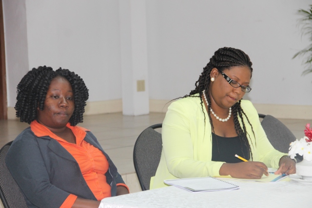 (L-R) Lanisa Burke, Youth Development Officer, and Zahnela Claxton, Coordinator of Youth Development in the Ministry of Youth and Sport at the opening ceremony of the Department of Youth and Sports Summer Job Attachment Programme at the St. Pauls Anglican Church Hall on June 29, 2015