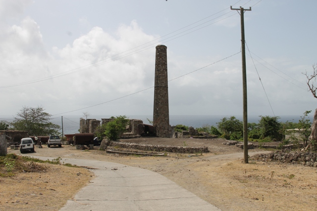 An open area where the Ministry of Tourism plans to erect a monument honouring slaves who worked at the New River Estate with the sugar mill in the background