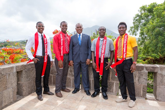 Premier of Nevis Hon. Vance Amory (middle) with Mr. Kool contestants (l-r) Arundell Dore, Romaine Mills, Delville Mills and Jevon Romney on the terrace on the top floor of the Nevis Island Administration on July 13, 2015. Contestant Wricherly Gumbs is absent