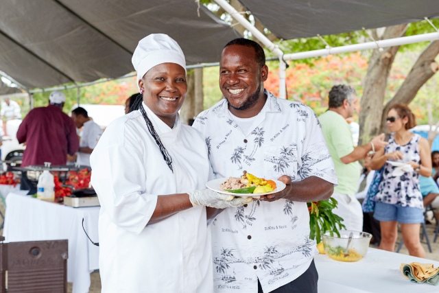 Chef Fredericks shows of her mango inspired dish with her husband at The Nevisian Mango Feast hosted by the Nevis Tourism Authority at Oualie Beach on July 12, 2015. Photo by Refined Digital Media