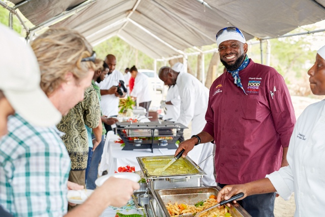 Chef Gregory and Chef D’Lashley serving patrons their mango inspired dishes at The Nevisian Mango Feast hosted by the Nevis Tourism Authority at Oualie Beach on July 12, 2015. Photo by Refined Digital Media
