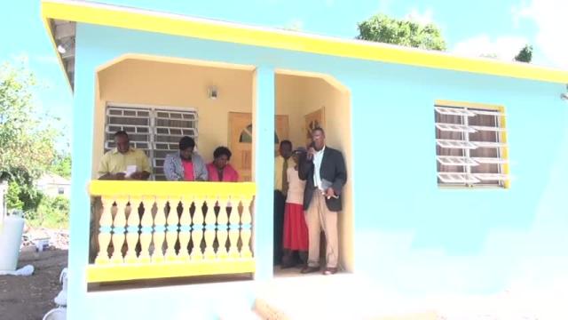 A new three-bedroom concrete house worth more than EC$75,000 handed over to 84-year-old Estelle Bartlette at Old Hospital Road on August 17, 2015