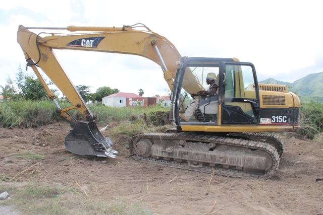 Land clearing with the assistance of equipment from the Nevis Housing and Lands Development Corporation to enhance the security of students and staff at the Medical University of the Americas at Pot Works on September 28, 2015