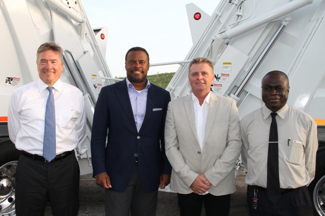 (L-R) Omni Global representative David Johnson, Deputy Premier of Nevis and Minister of Health Hon. Mark Brantley, Caribbean Region Operation Manager for US-based Omni Global Steve Hammond and General Manager of the Nevis Solid Waste Management Authority Andrew Hendrickson, at the handing over ceremony of two state-of-the-art Kenworth garbage collection trucks at the Long Point landfill on September 17, 2015