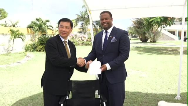 Resident Ambassador of the Republic of China/Taiwan, His Excellency Chiou Gow-Wei presents wheelchairs to Deputy Premier and Minister of Health in the Nevis Island Administration Hon. Mark Brantley at the grounds of the Alexandra Hospital on September 18, 2015