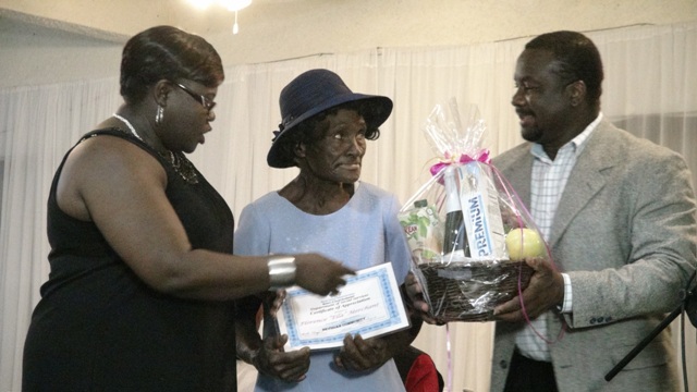 Junior Minister of Social Development Hon. Hazel Brandy-Williams presents award to Florence “Ella” Merchant at the 3rd Annual Gala and Awards Ceremony hosted by the Department of Social Services Seniors Division at the Occasions Conference Centre on October 27, 2015