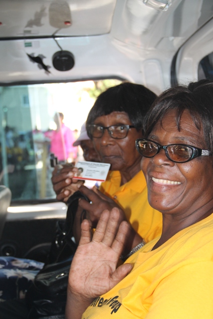 Visibly happy Seniors taking a short drive around the Memorial Square in Charlestown, moments after the Ministry of Social Development’s Seniors Subsidized Transportation Programme was launched at the Memorial Square in Charlestown on October 01, 2015