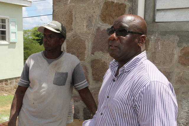 Minister of Housing and Lands on Nevis Hon. Alexis Jeffers and contractor for the Joycelyn Liburd Primary School expansion project Carlisle Maynard at the site of the project on September 28, 2015