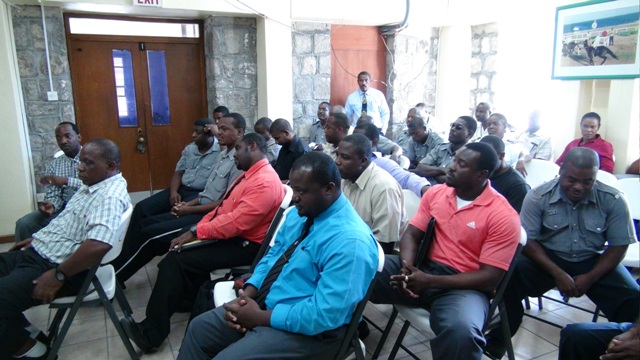 Officers stationed in Nevis at a meeting with Premier of Nevis and Minister of Security Hon. Vance Amory and Prime Minister of St. Kitts and Nevis and Minister of National Security Dr. the Hon. Timothy Harris at the Charlestown Police Station on October 14, 2015