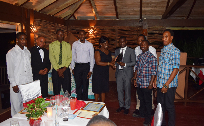 The Team Award from the Ministry of Finance and the Human Resources Department being presented to Director of the Information Technology Department Quincy Prentice and his staff by Premier of Nevis Hon. Vance Amory’s wife Mrs. Verni Amory, at the first IT Delta Awards on December 19, 2015, at the Nisbet Plantation Inn in recognition of their outstanding performance and dedicated service to the Nevis island Administration 